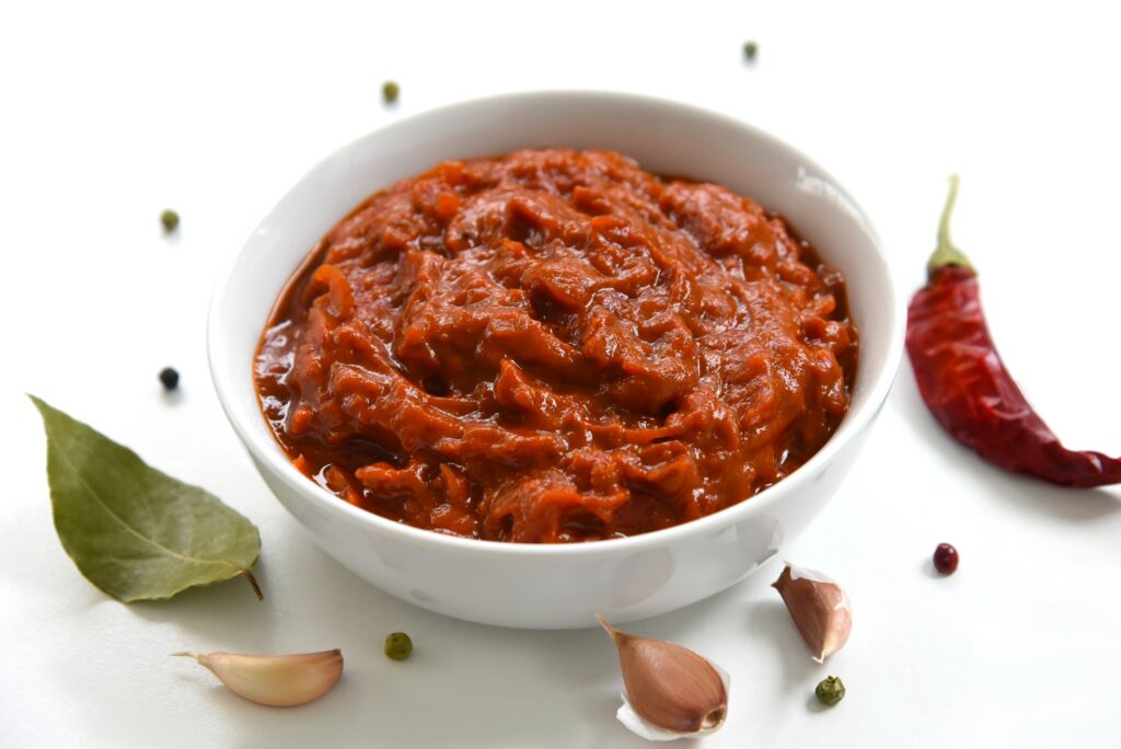 A,Bowl,Of,Red,Sauce,,Closeup,,Spices,,And,Hot,Chili